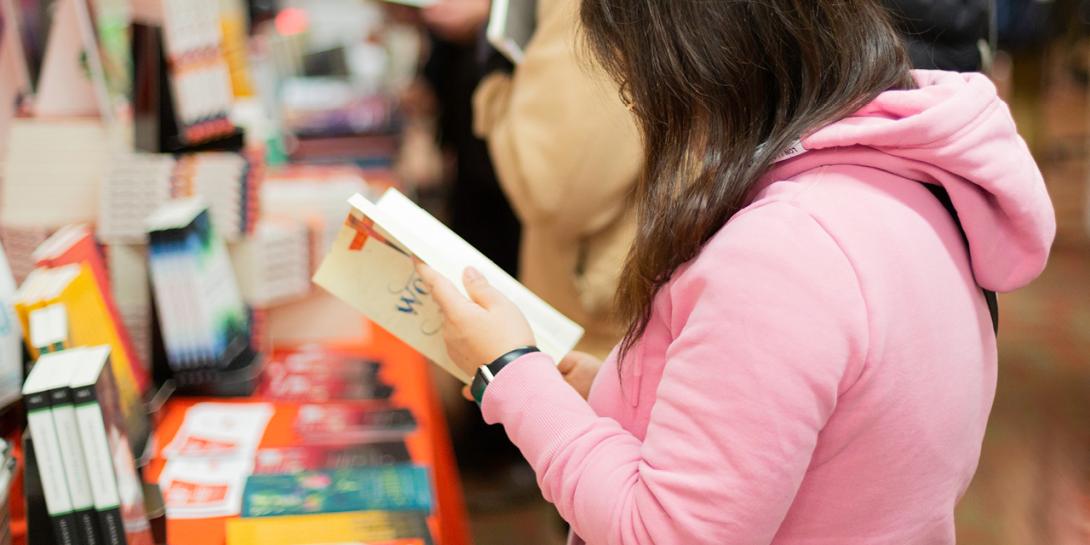 person looking at book